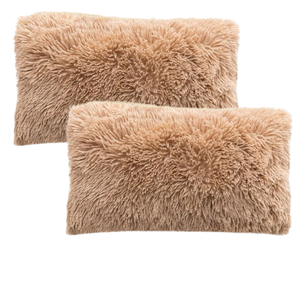 Set of two camel faux fur throw pillows with plush texture on a modern sofa

