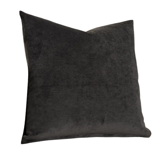Charcoal crushed velvet throw pillow, 16x16 square design with soft texture and reversible fabric, styled on a modern sofa for cozy, luxurious home decor.

