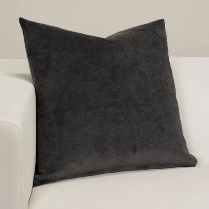 Charcoal crushed velvet throw pillow, 16x16 square design with soft texture and reversible fabric, styled on a modern sofa for cozy, luxurious home decor.

