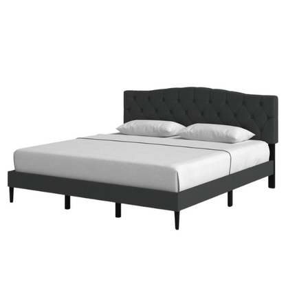 Charcoal grey upholstered king platform bed featuring a tufted camelback headboard, foam padding, and sturdy wood frame with slats and center support legs

