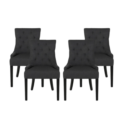 Set of four dark charcoal grey upholstered dining chairs featuring diamond tufted backs, armless design, sloped sides, and espresso wood legs.

