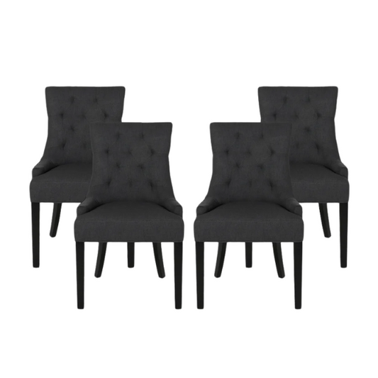 Set of four dark charcoal grey upholstered dining chairs featuring diamond tufted backs, armless design, sloped sides, and espresso wood legs.

