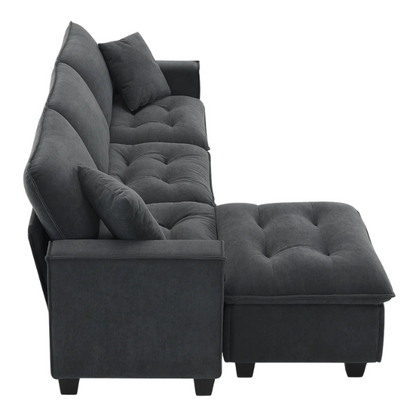 Charcoal grey suede L-shaped sectional sofa with tufted cushions, reversible chaise, removable ottoman, and two matching throw pillows