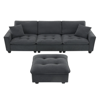 Charcoal grey suede L-shaped sectional sofa with tufted cushions, reversible chaise, removable ottoman, and two matching throw pillows