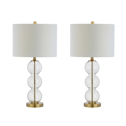 Set of 2 contemporary table lamps with clear glass triple-sphere base, gold accents, and white linen drum shade – modern glam bedside or living room lighting

