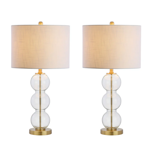 Set of 2 contemporary table lamps with clear glass triple-sphere base, gold accents, and white linen drum shade – modern glam bedside or living room lighting

