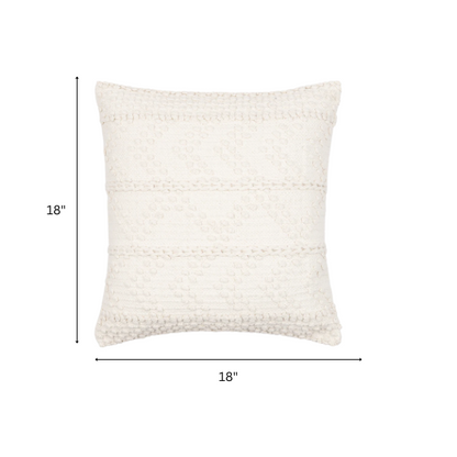 Cream handwoven boho throw pillow with chevron texture on a modern neutral-toned sofa

