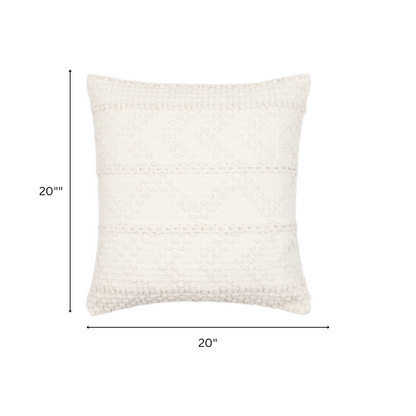 Cream handwoven boho throw pillow with chevron texture on a modern neutral-toned sofa

