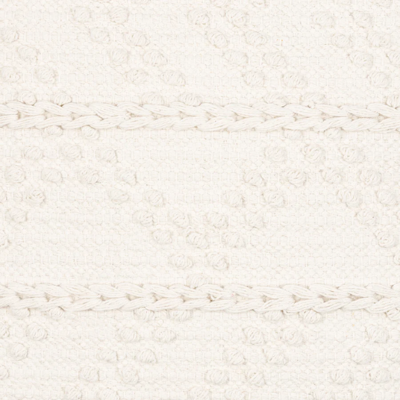 Cream handwoven boho throw pillow with chevron texture on a modern neutral-toned sofa

