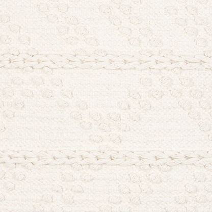 Cream handwoven boho throw pillow with chevron texture on a modern neutral-toned sofa

