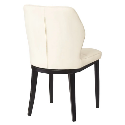 Set of two cream mid-century modern faux leather dining chairs with checkered stitching and metal legs
