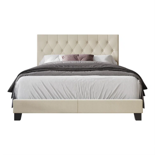 Cream linen full size upholstered bed with button tufted headboard and low-profile legs
