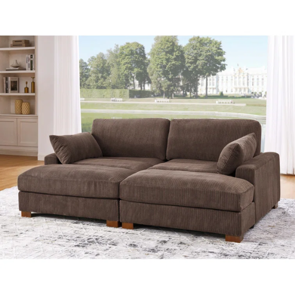 Dark brown corduroy convertible sleeper sofa with adjustable headrest, twin bed functionality, and mid-century wooden legs
