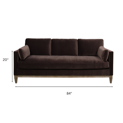 Dark brown velvet 3-seater sofa with feather-down cushions, square track arms, and natural wood legs, perfect for modern or traditional interiors.

