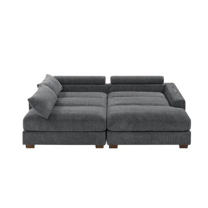 Dark grey corduroy convertible sleeper sofa with adjustable headrest, twin bed functionality, and mid-century modern wood legs