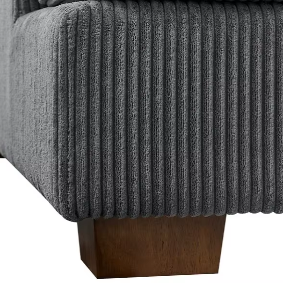 Dark grey corduroy convertible sleeper sofa with adjustable headrest, twin bed functionality, and mid-century modern wood legs