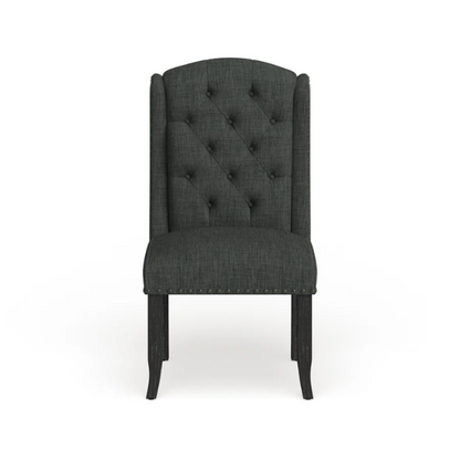 Set of two dark grey wingback farmhouse dining chairs with tufted backs, brass nailhead trim, and espresso-finished wooden legs


