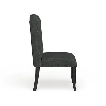 Set of two dark grey wingback farmhouse dining chairs with tufted backs, brass nailhead trim, and espresso-finished wooden legs

