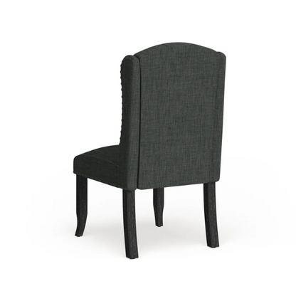 Set of two dark grey wingback farmhouse dining chairs with tufted backs, brass nailhead trim, and espresso-finished wooden legs


