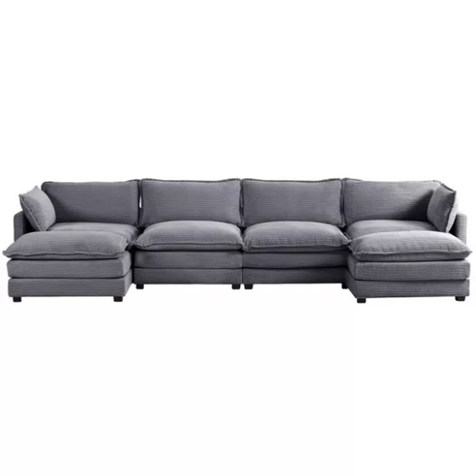 Dark grey 4-seat modular sectional sofa with two matching ottomans, upholstered in soft corduroy with high-resilience cushions and a sturdy wood and metal frame.