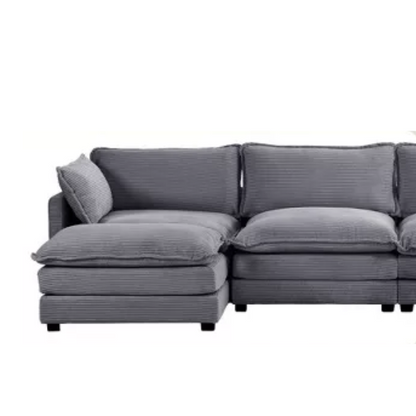 Dark grey 4-seat modular sectional sofa with two matching ottomans, upholstered in soft corduroy with high-resilience cushions and a sturdy wood and metal frame.