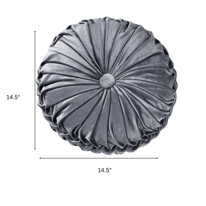 Dark grey velvet round throw pillows with hand-pleated design and button center, set of two 14.5-inch plush cushions styled in a modern living space.

