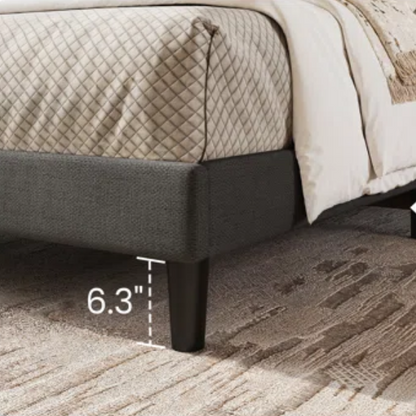 Dark grey upholstered queen platform bed with wingback headboard, slatted base, and black tapered legs – no box spring required


