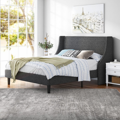 Dark grey upholstered queen platform bed with wingback headboard, slatted base, and black tapered legs – no box spring required

