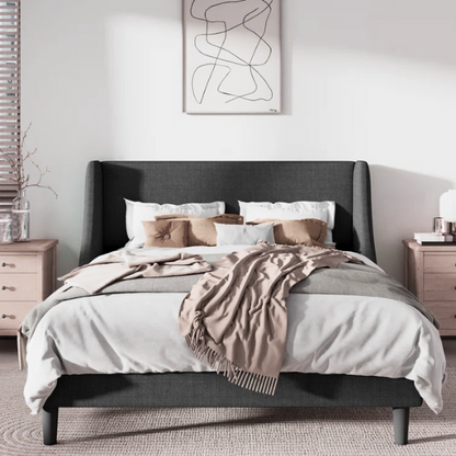 Dark grey upholstered queen platform bed with wingback headboard, slatted base, and black tapered legs – no box spring required

