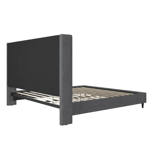 Dark grey soft woven upholstered king platform bed with tall wingback headboard and sturdy slat support.

