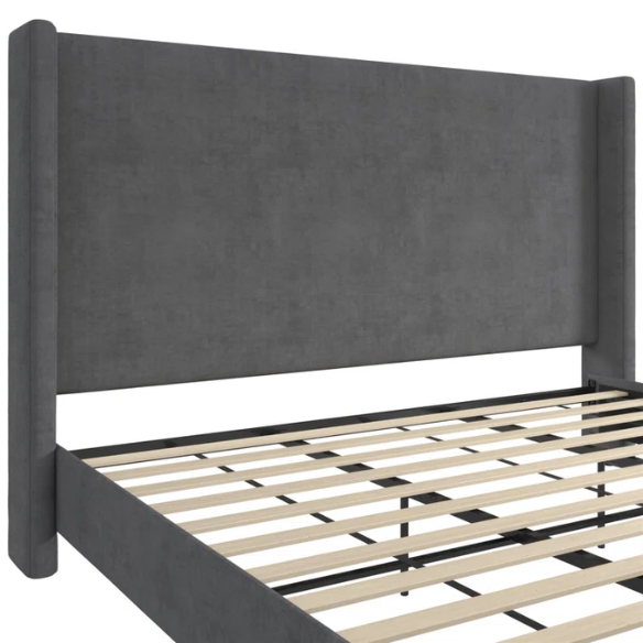 Dark grey soft woven upholstered king platform bed with tall wingback headboard and sturdy slat support.

