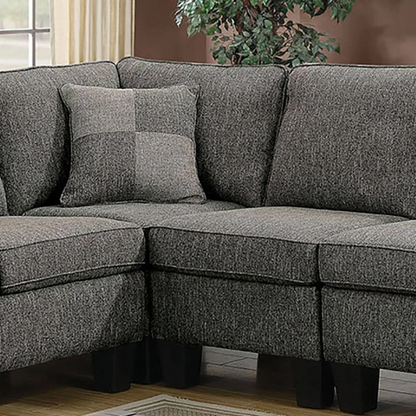 Dark grey transitional L-shaped sectional sofa with rolled arms, welt-trimmed cushions, and checkerboard accent pillows