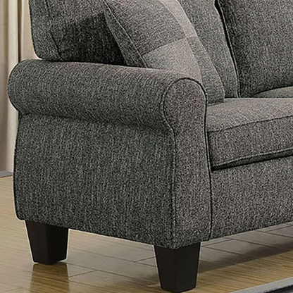 Dark grey transitional L-shaped sectional sofa with rolled arms, welt-trimmed cushions, and checkerboard accent pillows
