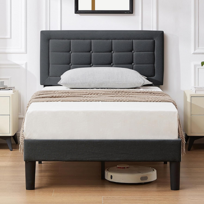 Dark grey twin-size upholstered platform bed with button-tufted adjustable headboard, wooden slats, steel center support, and underbed storage clearance.

