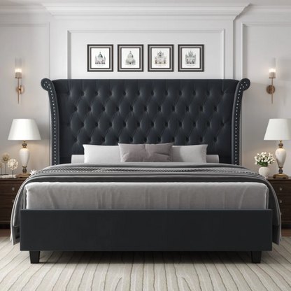 Dark grey velvet king-size platform bed with tall tufted wingback headboard, nailhead trim, and no box spring required

