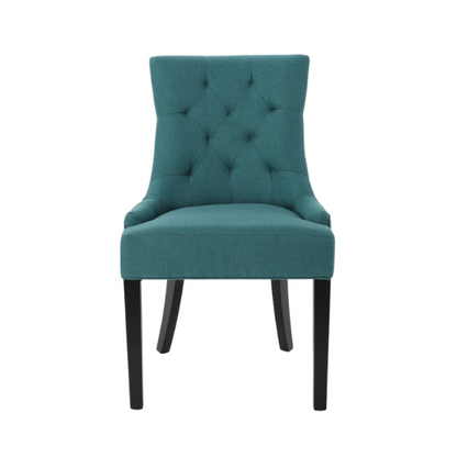 Set of four deep teal upholstered dining chairs with diamond tufted backs, armless design, sloped sides, and espresso brown wooden legs.

