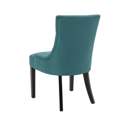 Set of four deep teal upholstered dining chairs with diamond tufted backs, armless design, sloped sides, and espresso brown wooden legs.

