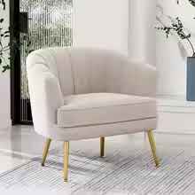 Elegant cream beige velvet shell-shaped accent chair with tufted design and gold-finished metal legs, offering comfort and modern sophistication for living rooms, bedrooms, or offices.