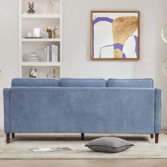 Dusty blue chenille upholstered sofa featuring curved track arms, tapered wooden legs, and foam-filled cushions in a mid-century modern design.