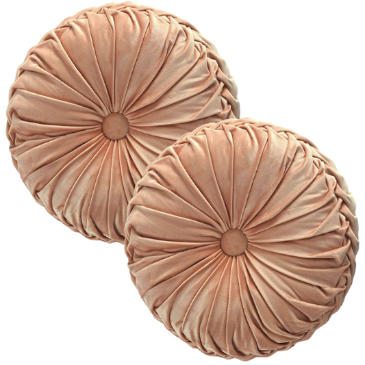Dusty rose velvet round throw pillows with pleated detail and central button, set of two 14.5-inch decorative cushions styled on a soft-toned couch.

