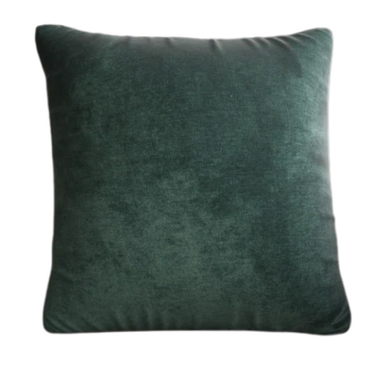 Emerald green crushed velvet throw pillow, 16x16 square design with soft texture and reversible fabric, styled on a modern sofa for vibrant, luxurious home decor.

