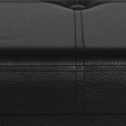 Foldable storage footrest ottoman in black faux leather with cushioned seat and ample storage space, perfect for modern living rooms.