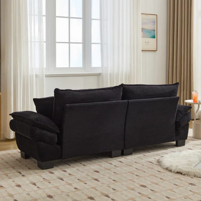 84-inch black corduroy loveseat with striped upholstery, pillow-top arms, and two accent pillows—modern, low-profile design ideal for contemporary living rooms or compact spaces.

