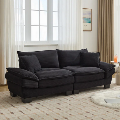 84-inch black corduroy loveseat with striped upholstery, pillow-top arms, and two accent pillows—modern, low-profile design ideal for contemporary living rooms or compact spaces.

