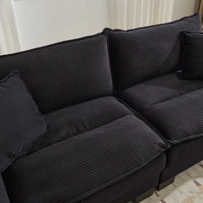 84-inch black corduroy loveseat with striped upholstery, pillow-top arms, and two accent pillows—modern, low-profile design ideal for contemporary living rooms or compact spaces.

