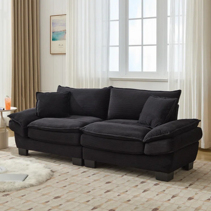 84-inch black corduroy loveseat with striped upholstery, pillow-top arms, and two accent pillows—modern, low-profile design ideal for contemporary living rooms or compact spaces.

