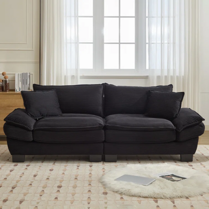 84-inch black corduroy loveseat with striped upholstery, pillow-top arms, and two accent pillows—modern, low-profile design ideal for contemporary living rooms or compact spaces.

