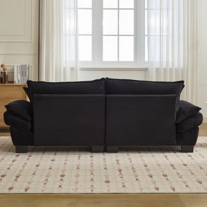 84-inch black corduroy loveseat with striped upholstery, pillow-top arms, and two accent pillows—modern, low-profile design ideal for contemporary living rooms or compact spaces.

