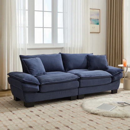 84-inch blue corduroy loveseat with striped upholstery, pillow-top arms, and two accent pillows—modern, low-profile design ideal for stylish living rooms or small spaces.

