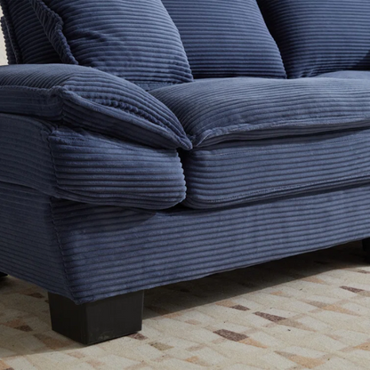 84-inch blue corduroy loveseat with striped upholstery, pillow-top arms, and two accent pillows—modern, low-profile design ideal for stylish living rooms or small spaces.

